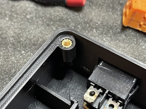 Corner of case with brass threaded inserts